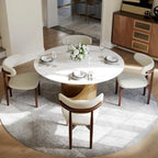 Table de salle à manger ronde moderne, plateau en pierre blanche brillante, pied en bronze carbone